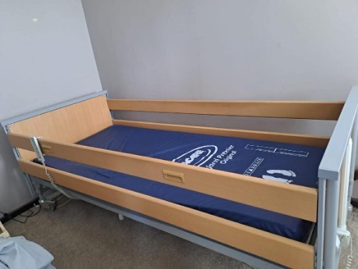 Electric adjustable bed with sides and wipe clean mattress